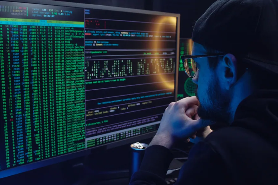 A security analyst reviewing penetration test output on a monitor
