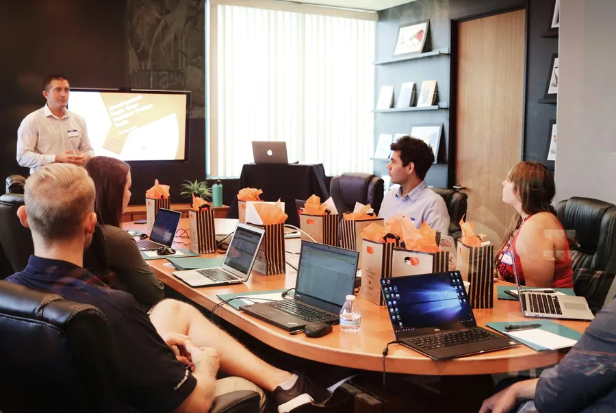 A trainer presenting to a group of employees